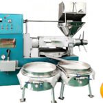 Industrial coffee roaster with dual drums and turquoise control panel for roasting beans, flame icon indicating roastingcool press coconut oil